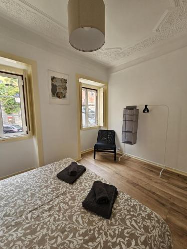 Ένα ή περισσότερα κρεβάτια σε δωμάτιο στο Maria Saudade Apartamento