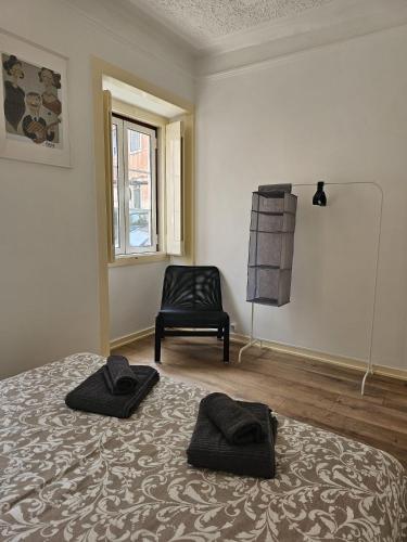 Ένα ή περισσότερα κρεβάτια σε δωμάτιο στο Maria Saudade Apartamento