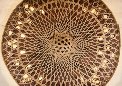 a metal ceiling with a design in the middle at Tiger Tops Karnali Lodge in Bardia