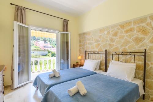 Кровать или кровати в номере Delfini Resort