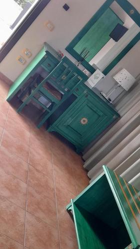 an overhead view of a room with green cabinets at Le Vanille in Costa Rei