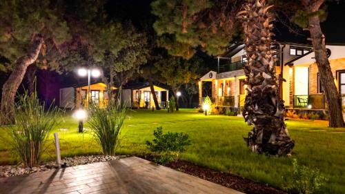 a house with a yard at night with lights at Elasu Bodrum in Bodrum City