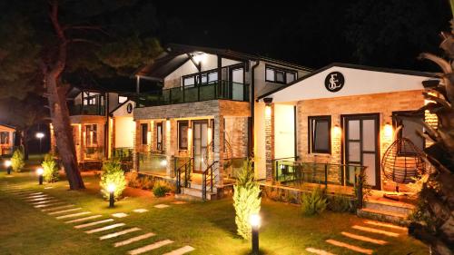 a house at night with lights in the yard at Elasu Bodrum in Bodrum City
