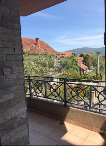 a balcony with a view of a city at Apartmani IVANA in Vrnjačka Banja
