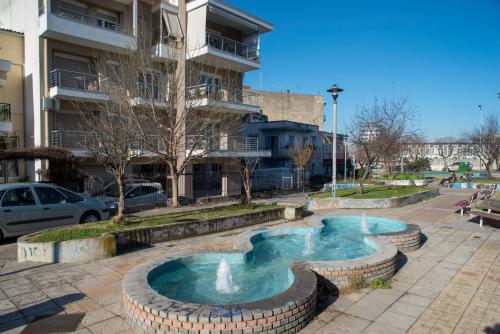 a small swimming pool in the middle of a city at Elpidas houses 2 Private parking Near city centre in Thessaloniki