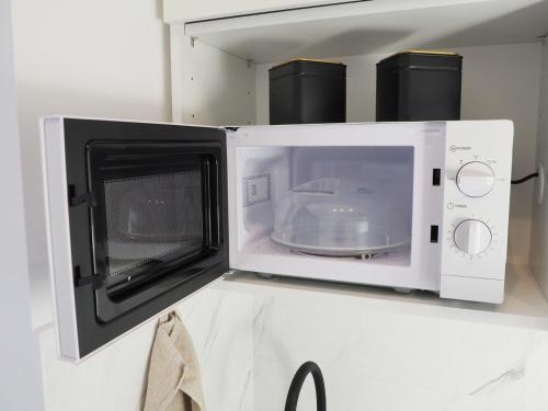 a microwave oven on top of a counter at OstWestApart A31 in Warsaw