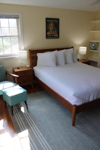 a bedroom with a large bed and a window at The Emory House in Emory