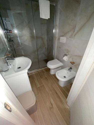 a bathroom with a sink and a toilet and a shower at Antico Palazzo Spinola in Gallipoli