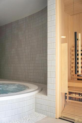 a bathroom with a jacuzzi tub in a room at Bella Monte in Szczyrk