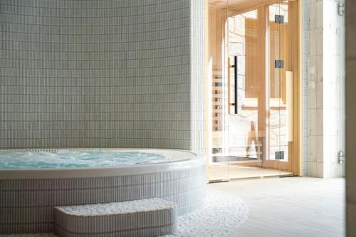 a bathroom with a jacuzzi tub at Bella Monte in Szczyrk