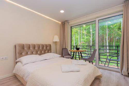 Ένα ή περισσότερα κρεβάτια σε δωμάτιο στο Seaside apartments 2