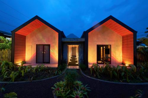 a rendering of a house at night at Suwa Villa Arenal in Fortuna