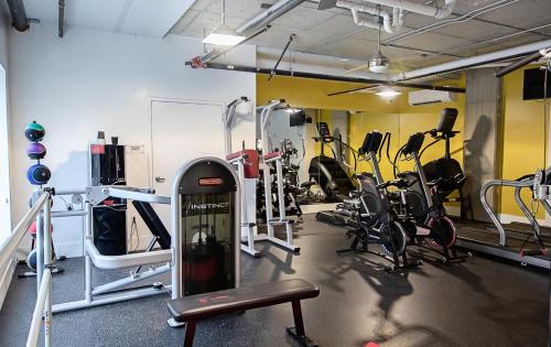 a gym with several treadmills and bikes in it at Kasa Downtown Salt Lake City in Salt Lake City