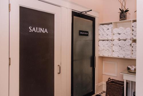 a black door with the word sauna written on it at Ashland Springs Hotel in Ashland