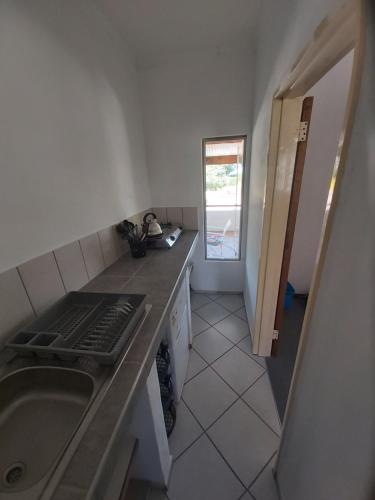 a kitchen with a sink and a counter top at BKZ Self-Catering in Solitaire