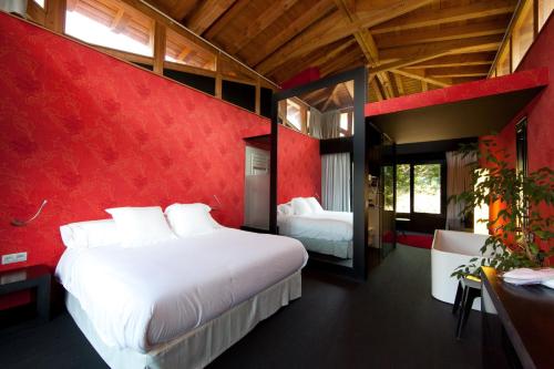 A bed or beds in a room at Ellauri Hotel - Adults Only