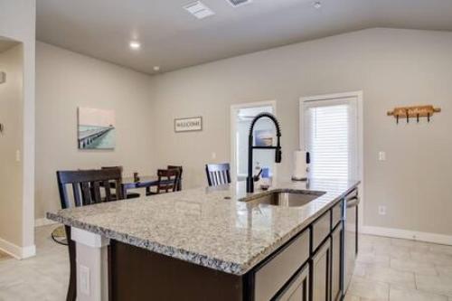 a kitchen with a sink and a counter top at Milano Lodge - Cozy Retreat in Lubbock