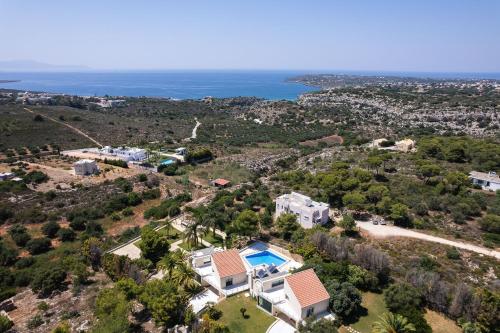 an aerial view of a house and the ocean at Angels Villa Chania in Kambánion