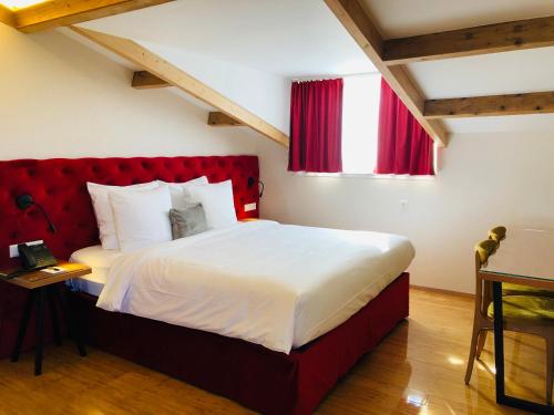 Ένα ή περισσότερα κρεβάτια σε δωμάτιο στο Chassé Hotel Residency
