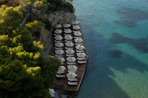 an aerial view of a resort on the water at Sirene Blue Luxury Beach Resort in Poros