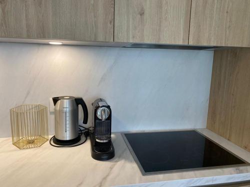 a coffeemaker sitting on a counter with a coffee maker at Appartement Calpe ApoloV Ibiza Style in Calpe