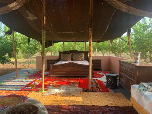 a bedroom with a bed in a gazebo at Ferme de Saba in Tiflet