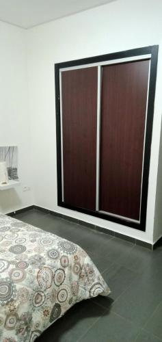 Cama o camas de una habitación en Appartement Familial avec Jardin, Résidence avec Piscine Dar El Bahr