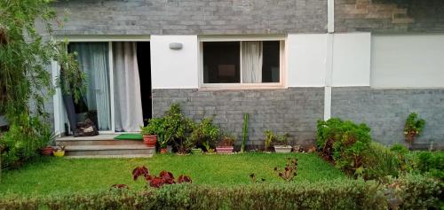 Jardín al aire libre en Appartement Familial avec Jardin, Résidence avec Piscine Dar El Bahr