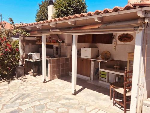 a kitchen under a pergola on a patio at Seas the Day in Preveza