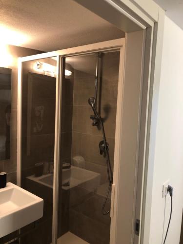 a bathroom with a shower and a sink at Hotel Rex in Lido di Savio