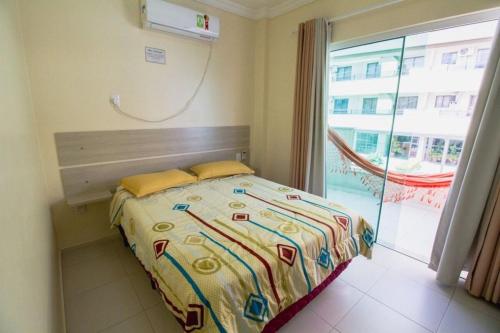 Postel nebo postele na pokoji v ubytování 101- Apartamento em Bombas