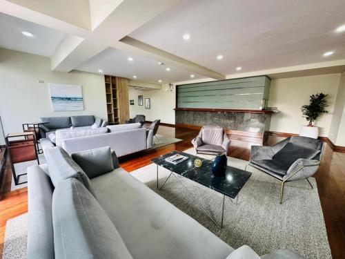 a large living room with couches and a table at Miraflores Confort Suite in Lima