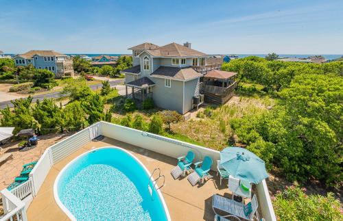 an aerial view of a house with a swimming pool at Simple Gifts by the Sea in Duck