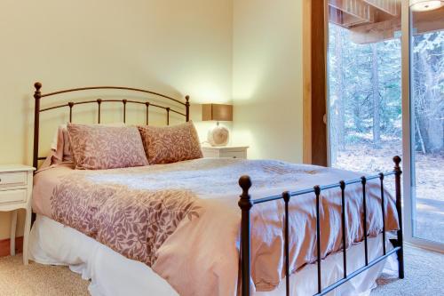 a bedroom with a large bed and a window at Tahoma Deluxe Brand New Home in Tahoma