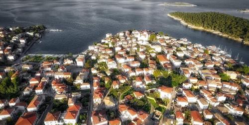 an aerial view of a small town next to the water at Penny's Beach Cottage in Galaxidhion