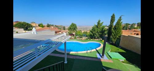 a view of a swimming pool from a house at Casa El Mirador 