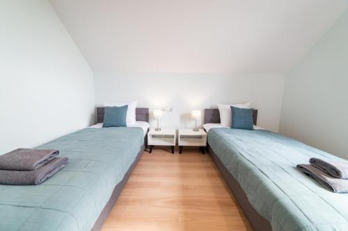 Katil atau katil-katil dalam bilik di Apartamenty Literówka