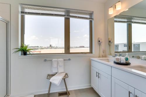 a bathroom with a sink and a window at WFH-Friendly Philadelphia Rental Near Center City! in Philadelphia