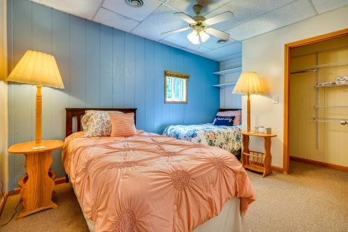 a bedroom with two beds and a ceiling fan at Quaint Somerset Getaway with Fire Pit! in Mount Perry