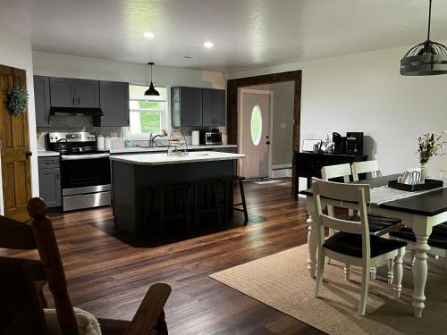 a kitchen and dining room with a table and a dining room at Country Hills Hideaway in Millersburg