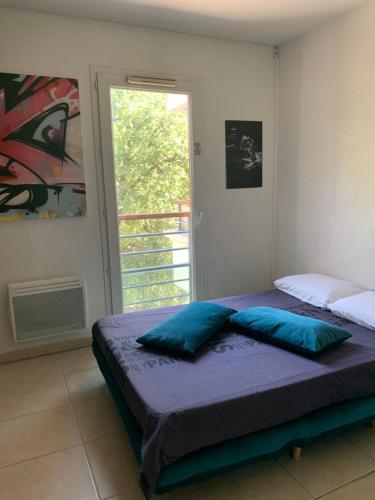 Posteľ alebo postele v izbe v ubytovaní Votre séjour cosy à Frejus!