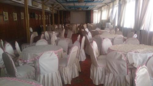 a row of chairs and tables in a room at Salvatore Room With Breakfast-Tanta City in Tanta