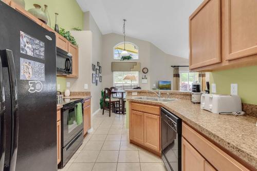 a kitchen with a sink and a counter top at 4 bedrooms pool home gated resort of Veranda Palms in Kissimmee