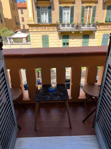 a balcony with a table and chairs and a building at Casa di Esti in La Spezia