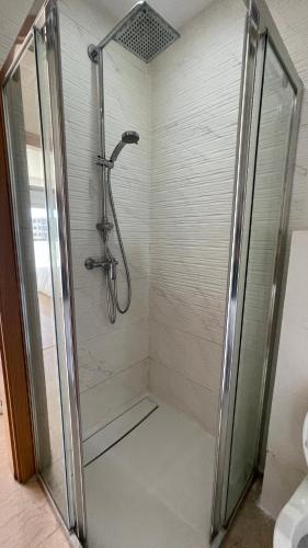 a shower with a glass door in a bathroom at Cosy Bay appartement 4 - 5px in Agadir