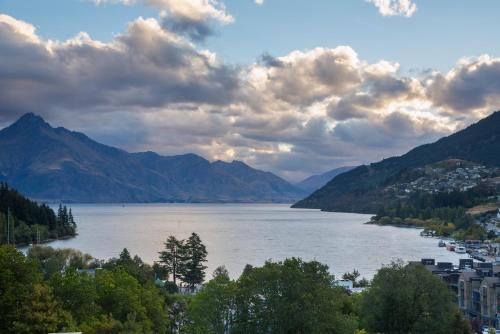 a view of a lake with mountains in the background at The Glebe Apartments in Queenstown