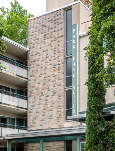 a building with a sign on the side of it at Park Lane Suites & Inn in Portland