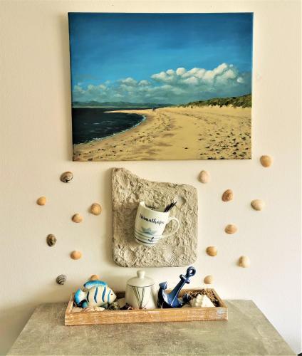 a picture of a beach with a painting on the wall at Bremen City in Bremen