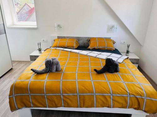 a bedroom with a bed with two shoes on it at Apartments with parking space Delnice, Gorski kotar - 21611 in Delnice