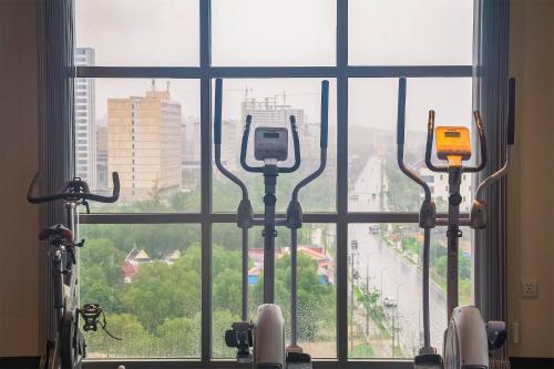 a view of a city from a large window at Sea Breeze Hotel & Villa in Sihanoukville
